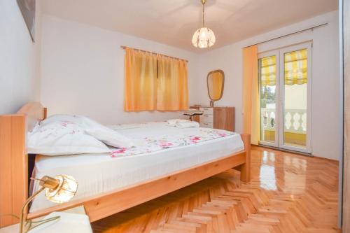 Posteľ alebo postele v izbe v ubytovaní Apartments Dandelion