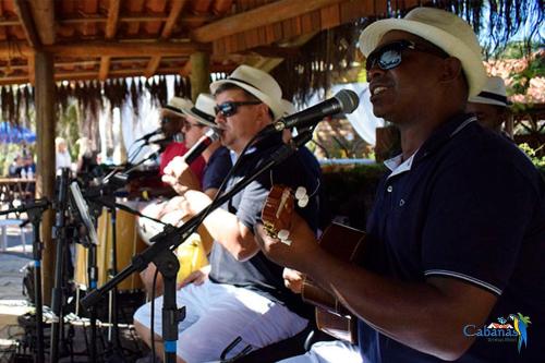a group of men singing and playing instruments at Cabanas Termas Hotel in Gravatal