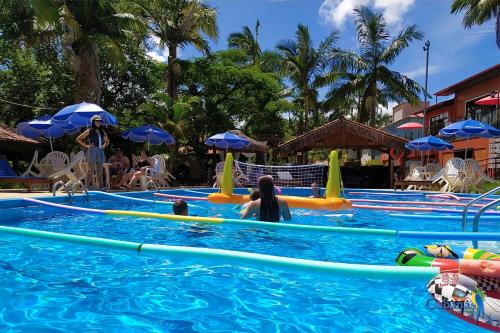 a group of people in a pool at a resort at Cabanas Termas Hotel in Gravatal