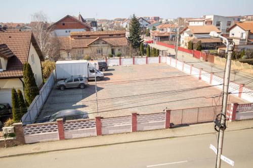 a parking lot with a car parked in it at Hotel Alexandra in Timişoara