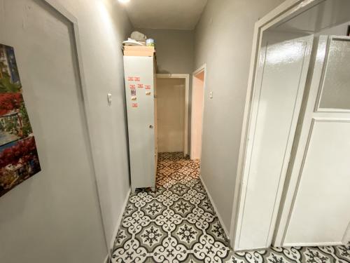 a hallway with a door and a tile floor at CityHub in Antalya