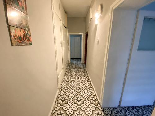 an empty hallway with a tile floor in a room at CityHub in Antalya