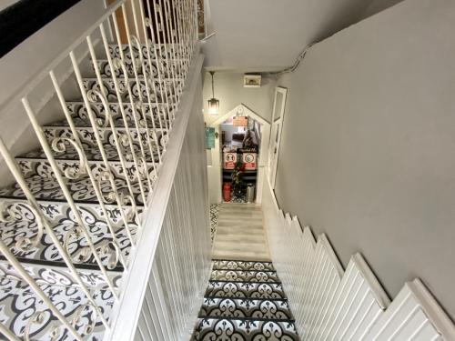 a stairway with white railings and a white stair case at CityHub in Antalya