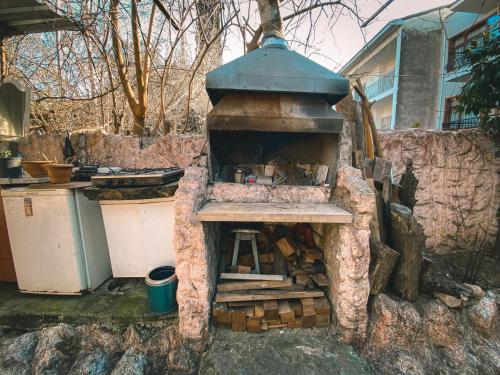 an outdoor pizza oven in the backyard of a house at CityHub in Antalya