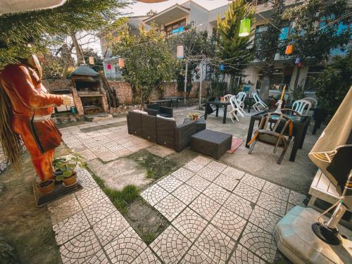 a statue of a woman standing in front of a garden at CityHub in Antalya