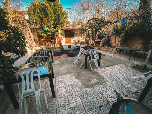 a patio with chairs and tables and a couch at CityHub in Antalya
