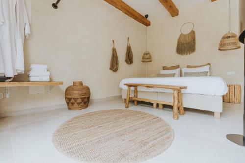 a bedroom with a bed and a rug at Hotel Anilevich Mansion in Beer Sheva