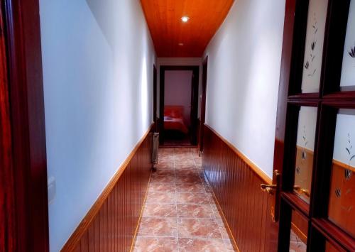 an empty hallway with a corridorngthngthngthngthngthngthngthngthngthngth at Casa Rural Burón in Posada de Valdeón