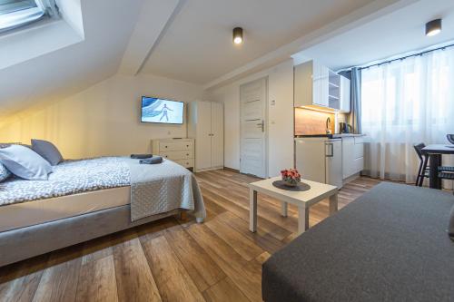 Ein Bett oder Betten in einem Zimmer der Unterkunft Willa Maria i Natasza