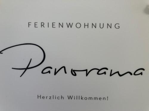 a sign with the wordsfemingiving dancingankingarfificialffitiernesserness at Ferienwohnung Panorama in Forchheim