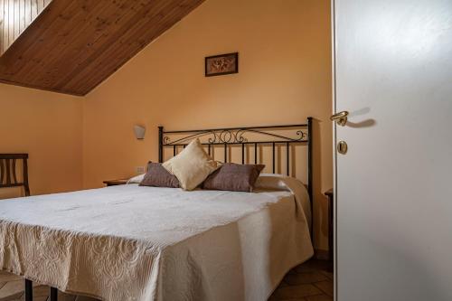 Ένα ή περισσότερα κρεβάτια σε δωμάτιο στο Bed and Breakfast Donna Olimpia