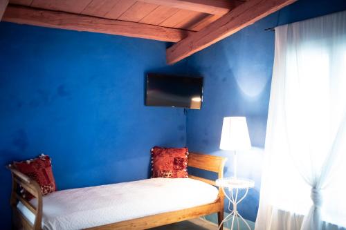 Postel nebo postele na pokoji v ubytování Turchi Farm - Locanda della Luna & Antico Frantoio