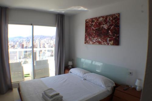 Postel nebo postele na pokoji v ubytování SAN MARINO I 19-D Levante Beach