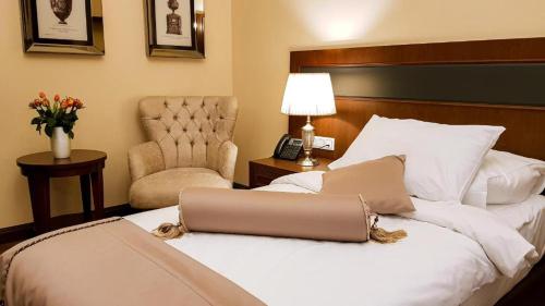 
Posteľ alebo postele v izbe v ubytovaní Hotel Michael's Palace
