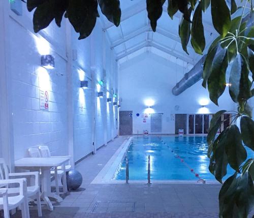a large swimming pool with a pool at Sandy Feet in Filey