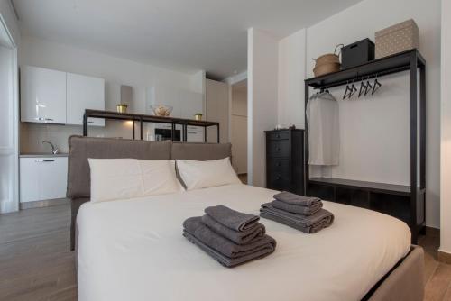 A bed or beds in a room at Gaffurio Apartments