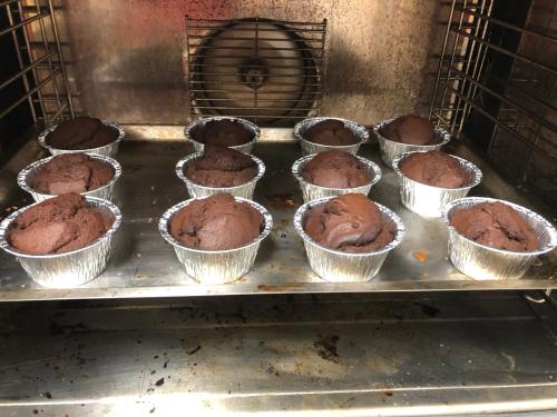 a bunch of muffins in muffin pans in an oven at mammaCristina in Patti