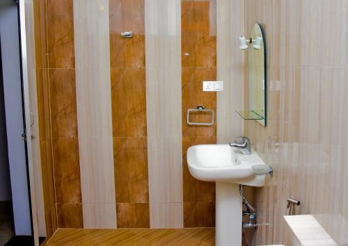 a bathroom with a sink and a shower at Grand Royal Villa Negombo in Negombo