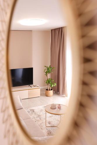 a living room with a tv and a table at D-Palace-Adriatic in Donji Zemunik