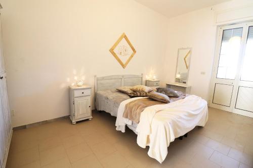 A bed or beds in a room at Casa Vacanza Black Magic Otranto