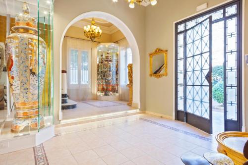 a room with a large glass door and an entry way at Villa Victoria Barcelona in Barcelona