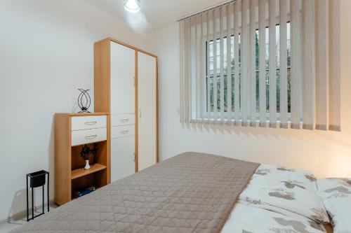 מיטה או מיטות בחדר ב-Apartmán vo vile Kammergraf