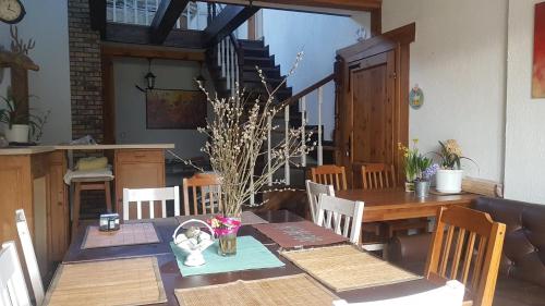 a dining room with a table and a table and chairs at Kurnik Polski agroturystyka in Tykocin