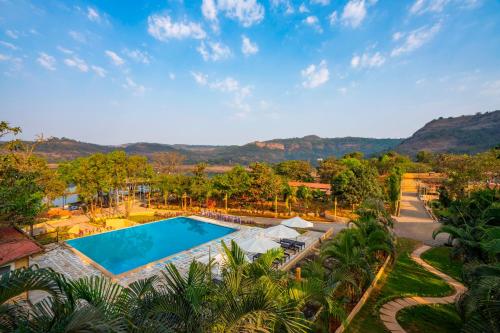 an aerial view of a resort with a swimming pool at Zostel Plus Lonavala in Lonavala