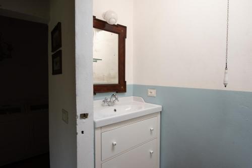 a bathroom with a sink and a mirror at Stone House 15th Century in Vicchio