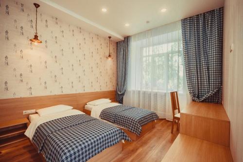 Кровать или кровати в номере Гостиница Палуба
