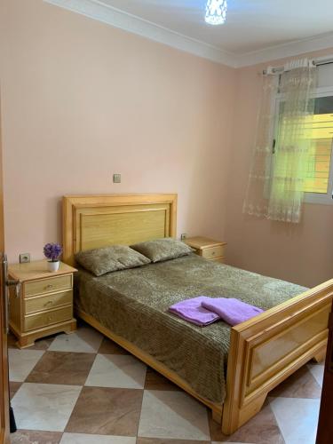 Säng eller sängar i ett rum på Appartement Mus saidia 1