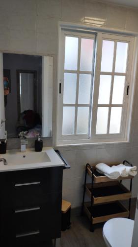 a bathroom with a sink and a mirror at Casa Concha in Muros