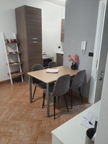 a dining room table and chairs in a room at Lamezia Park Apartments in Lamezia Terme