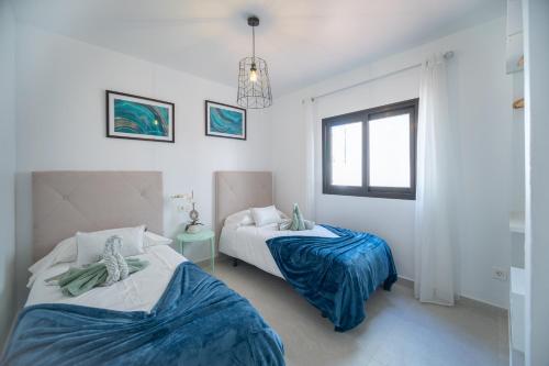 En eller flere senge i et værelse på Bimba's