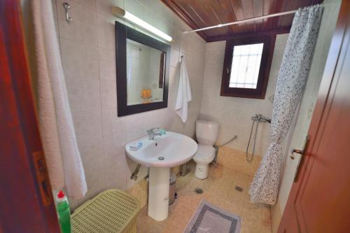 a bathroom with a sink and a toilet at Cretan Nature in Kissamos