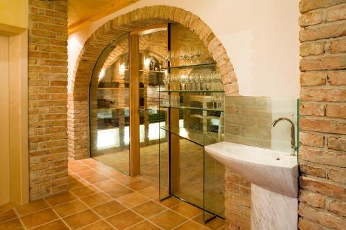 a bathroom with a glass shower and a sink at Weingut Schwarzl in Ratsch an der Weinstraße