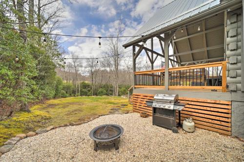 a house with a stove in front of it at Deck and Fire Pits Lake Toxaway Getaway! in Lake Toxaway