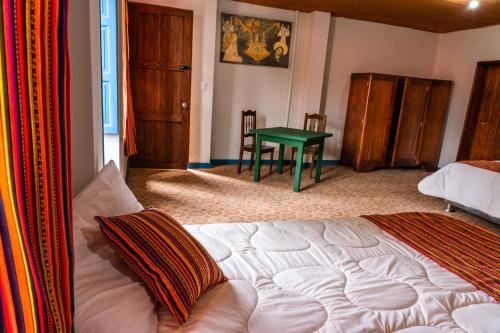 Ένα ή περισσότερα κρεβάτια σε δωμάτιο στο Casona Museo Catalina Huanca