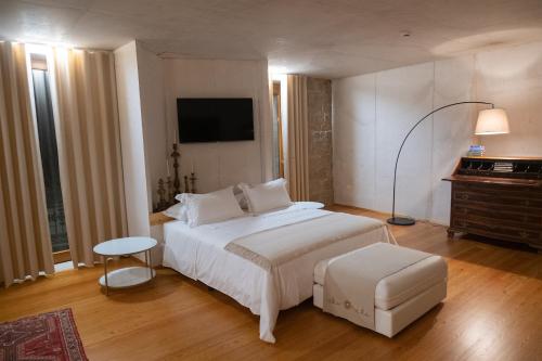 Postel nebo postele na pokoji v ubytování Casa das Ameias