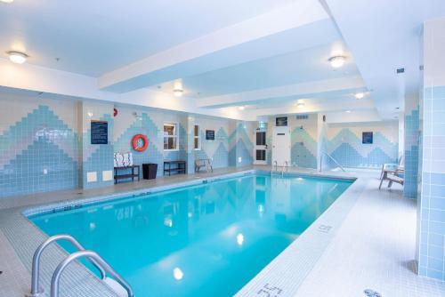 a large swimming pool in a hotel room at Sandman Hotel Vancouver Airport in Richmond