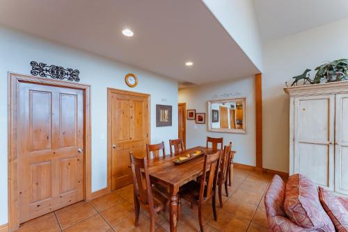 a dining room with a wooden table and chairs at Zion Ponderosa Ranch Resort in Springdale