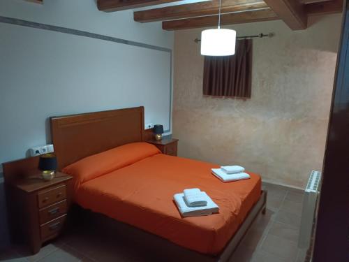 Casa Castell tesisinde bir odada yatak veya yataklar