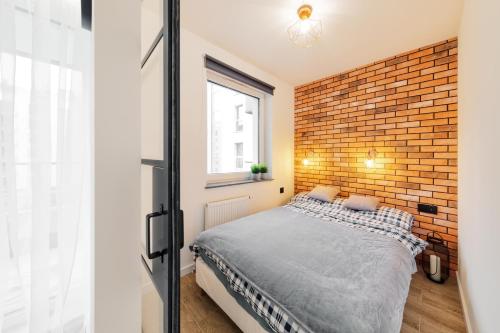 Posteľ alebo postele v izbe v ubytovaní Angielska Grobla Apartment by PIROKO