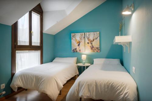 Postel nebo postele na pokoji v ubytování CASA CON JARDIN EN HECHO