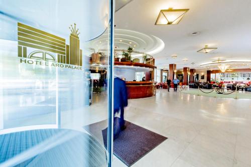 a lobby of a hotel argerate with a glass wall at Hotel Aro Palace in Braşov