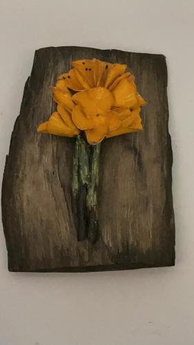 a painting of a yellow flower on a wall at Agroturystyka Hanka i Jurek in Boruja