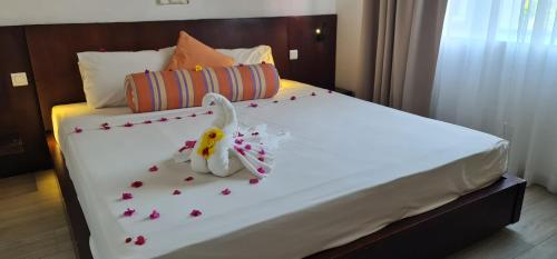 a bed with a bunny made out of flowers on it at Ocean Villas Apart Hotel by Ocean Hospitality in Grand-Baie