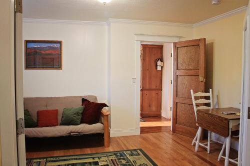 a living room with a couch and a table at Bowen Motel in Moab
