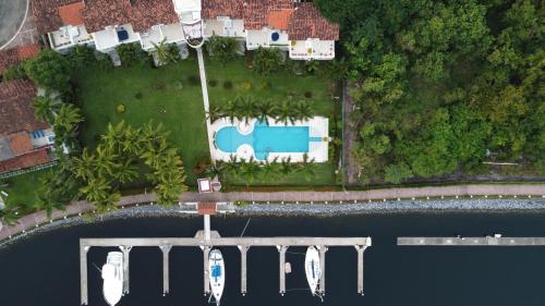 an aerial view of a house next to the water at Villa Marina Ixtapa in Ixtapa