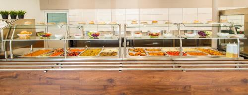 a buffet line with many different types of food at Industrial Belišće in Belišće
